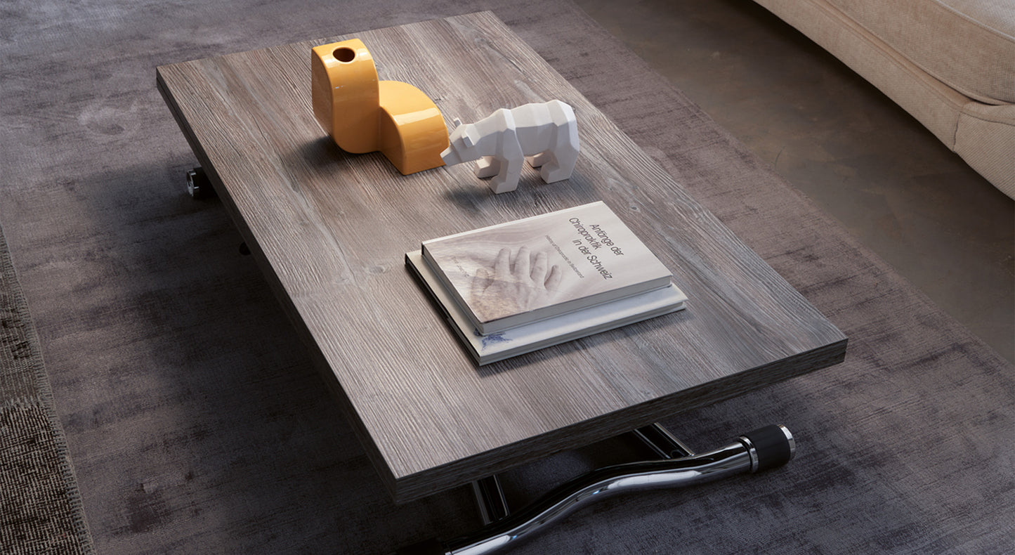 Table basse extensible en bois, modèle Sydney, fermée, avec objets décoratifs et livres sur un tapis gris
