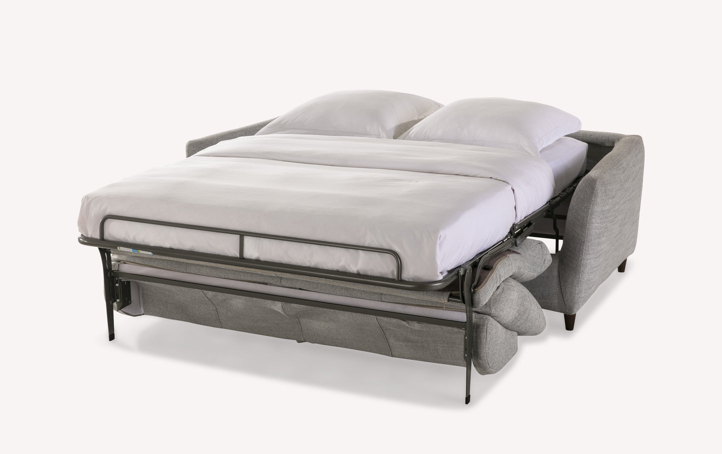 Canapé convertible gris "Bow" ouvert en position lit avec matelas et oreillers blancs