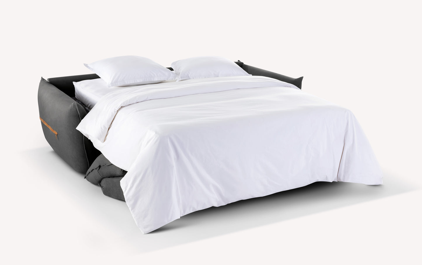 Canapé convertible Elie ouvert en tissu gris foncé, avec draps blancs et deux oreillers, modèle Ibis Lave