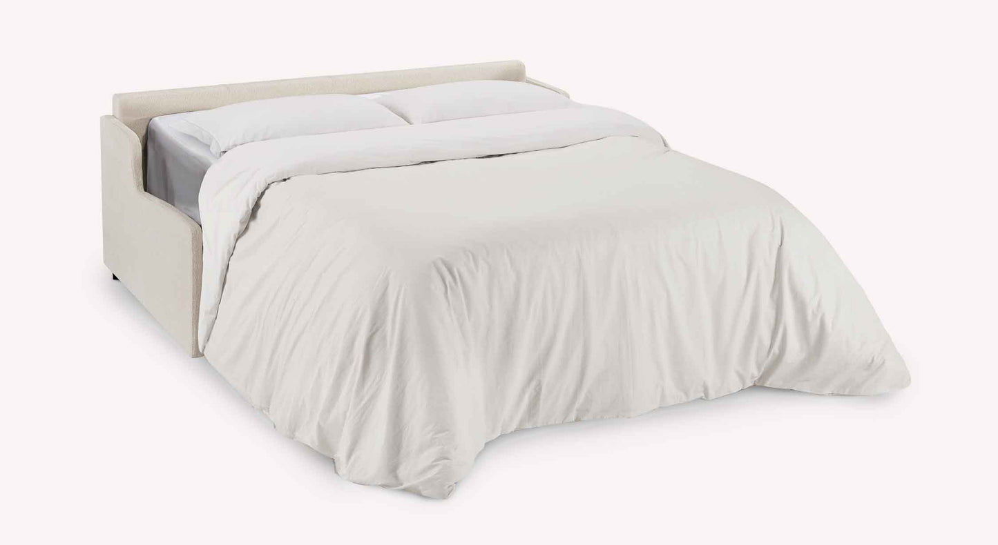 Canapé convertible JERRY Mini Misterio Ivoire déplié en lit double avec un matelas blanc et couette beige, design épuré et moderne adapté pour un couchage quotidien.