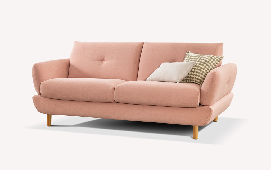 Canapé convertible rose en tissu, modèle Finn, avec coussins décoratifs, pieds en bois clair