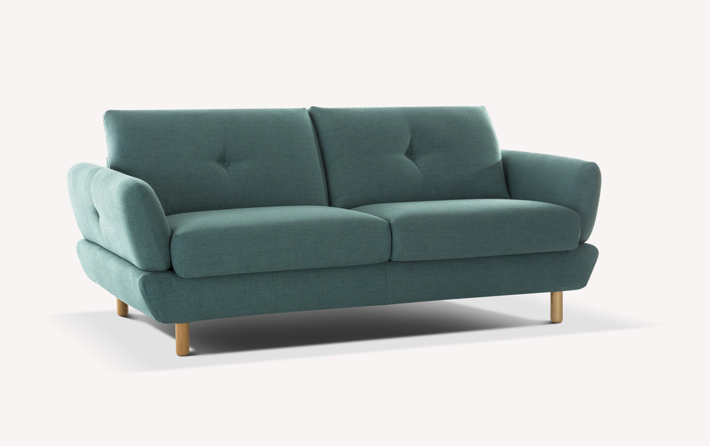 Canapé convertible en tissu vert avec accoudoirs arrondis et pieds en bois, modèle Finn