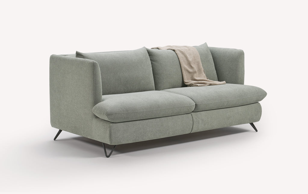 Canapé convertible en tissu lagon avec pieds en métal noir, plaid beige sur l'accoudoir